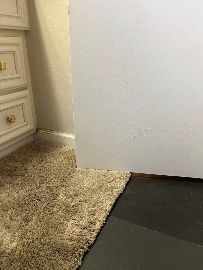 Door repair to fit the rug on the floor in master bathroom